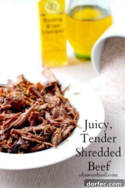 Close-up of shredded beef, illustrating its tender texture and rich juices, ideal for a variety of meals.