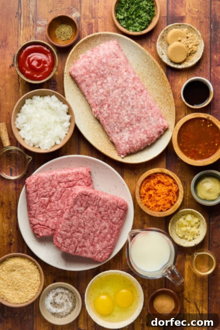 A vibrant display of fresh ingredients for classic meatloaf, including ground meats, eggs, vegetables, and seasonings, ready for preparation.