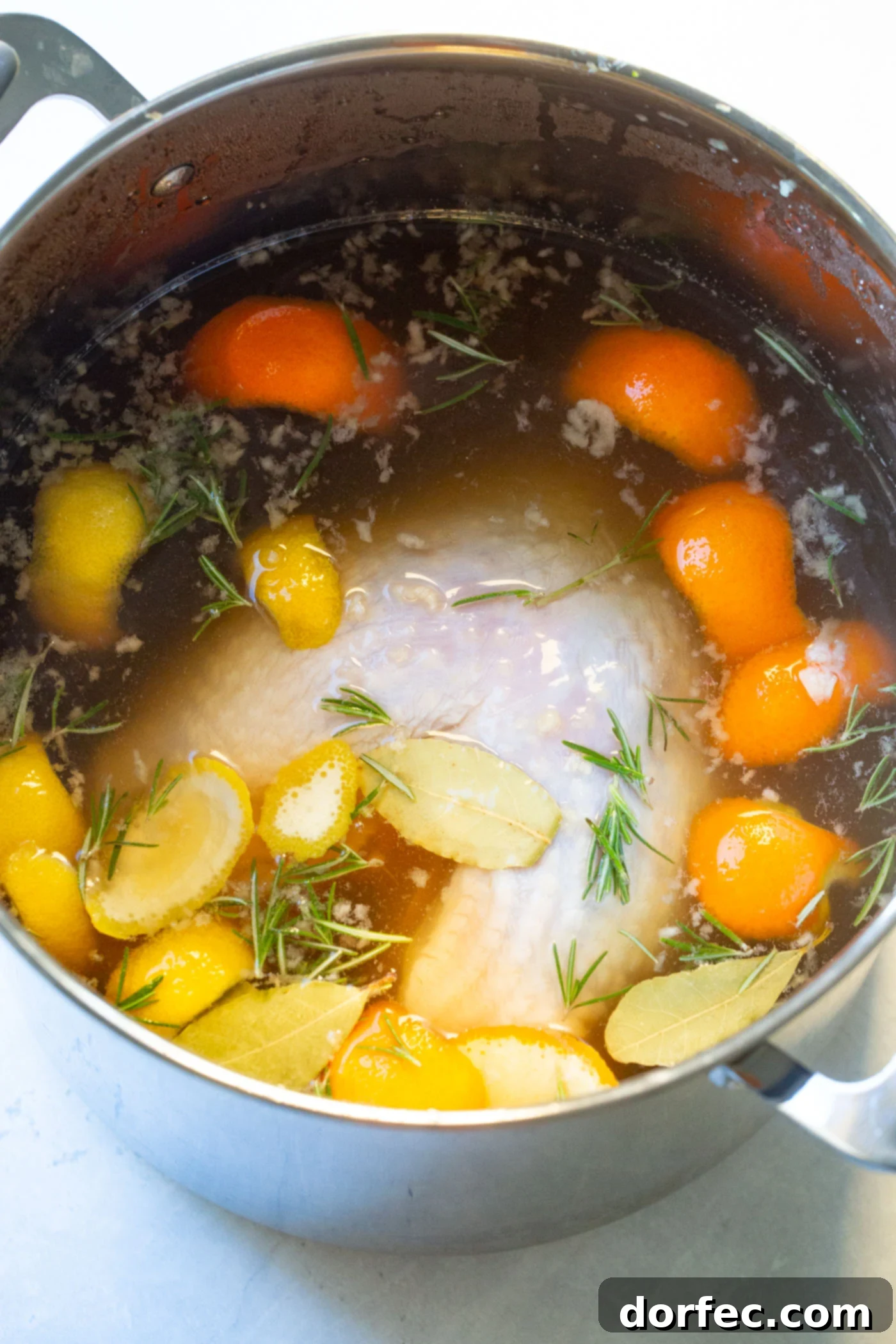 Melt-in-Your-Mouth Slow Cooker Turkey Breast Recipe 3 A large stock pot filled with an aromatic turkey brine solution, ready for the turkey.