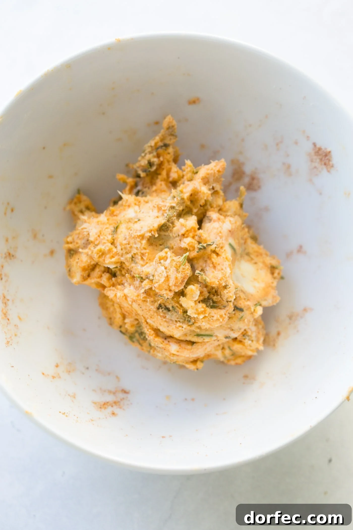 Melt-in-Your-Mouth Slow Cooker Turkey Breast Recipe 4 A bowl of freshly prepared herb compound butter, ready to be spread on the turkey breast.
