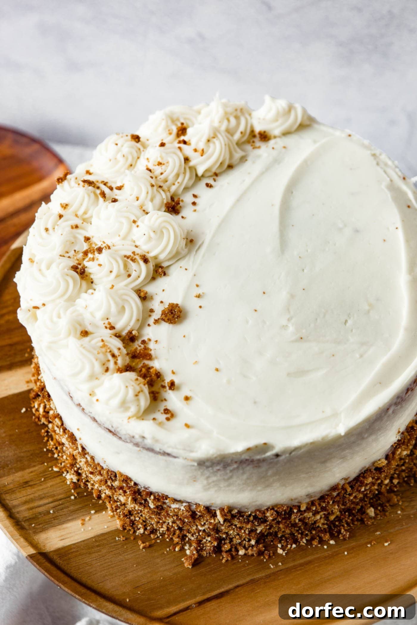 Frosted Spice Cake Top View Top-down view of a fully frosted two-layer spice cake with generous cream cheese frosting swirls.