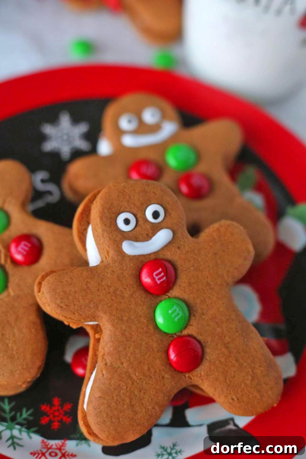 Gingerbread Men Sandwich Cookies arranged beautifully on a plate, showcasing their soft texture and creamy filling, ready to bring joy this holiday season.
