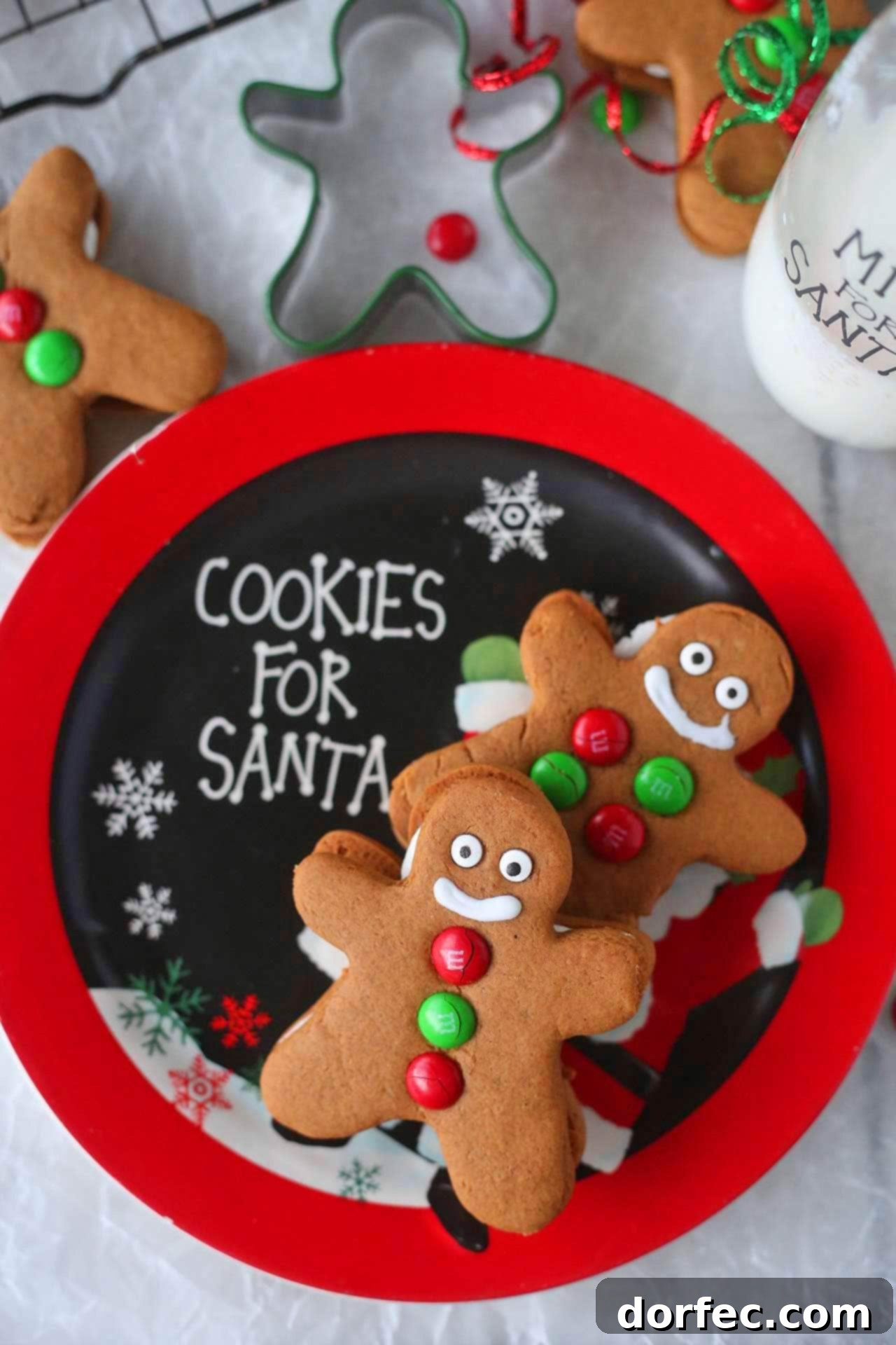 Decorated Gingerbread Men Sandwich Cookies with candy eyes and M&M buttons, showcasing simple yet charming holiday decorations.