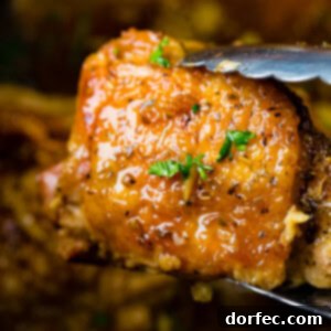 A close-up image of the slow cooker garlic chicken, showing the rich brown sugar glaze and tender meat.