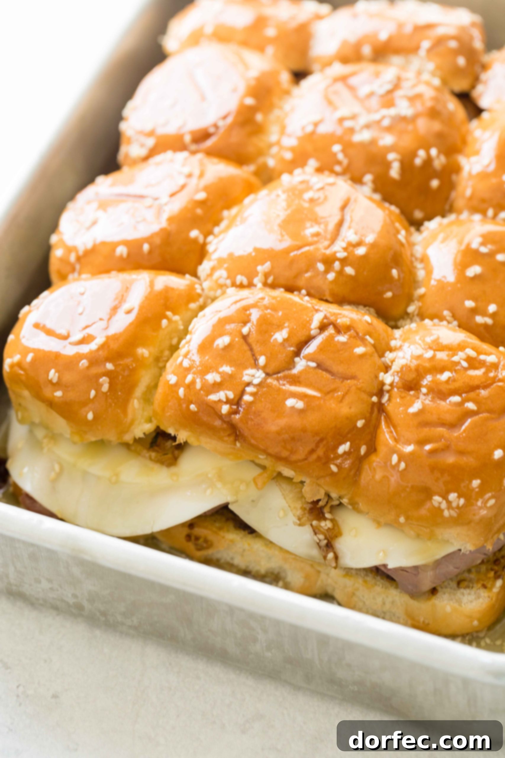 A photo of the french dip sliders with the top rolls added, completing the assembly.