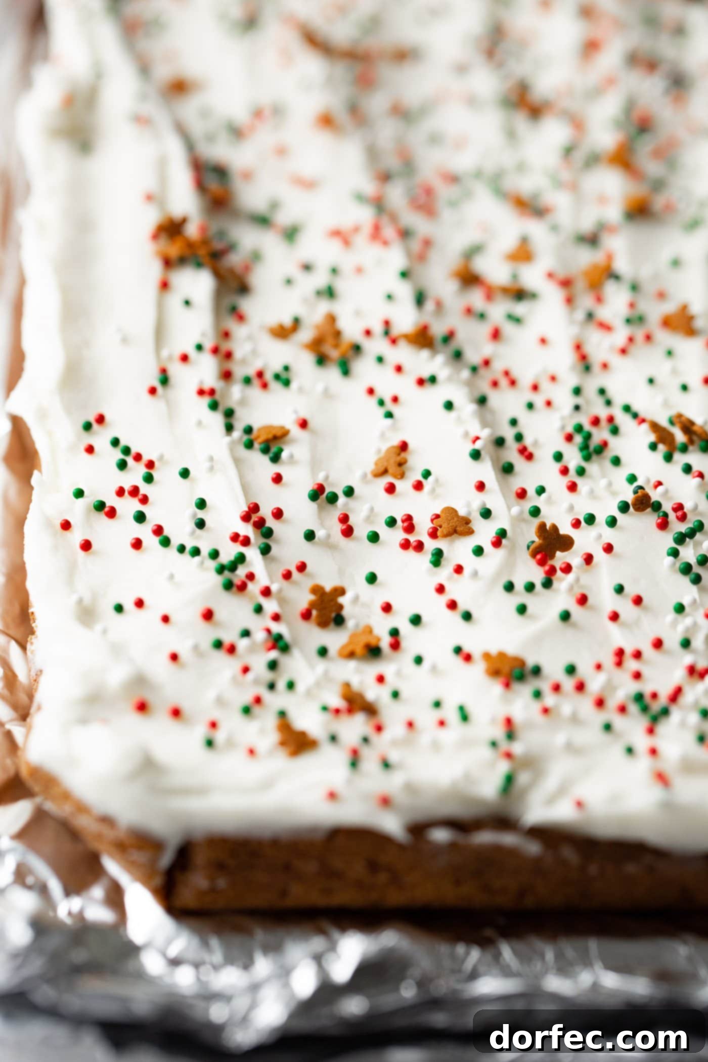 A photo of a pan of frosted gingerbread bars before being cut.