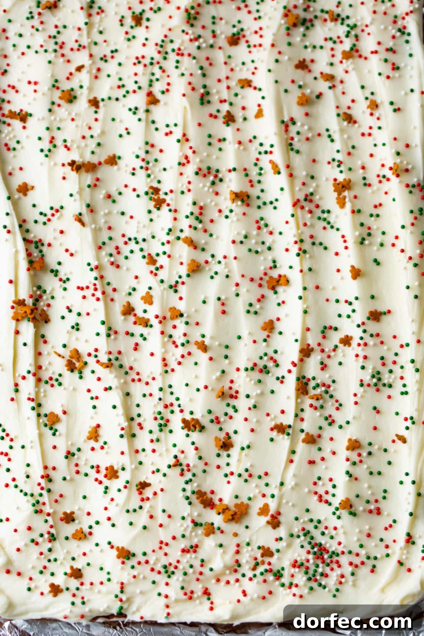 A photo of a pan of frosted gingerbread bars before being cut.