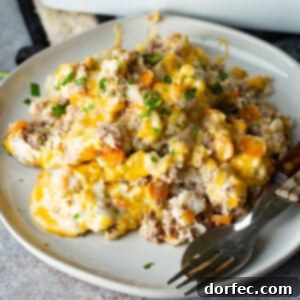 A square image of the Low Carb Cheesy Ground Beef and Cauliflower Rice Casserole, showcasing its rich, golden-brown top and comforting appeal.