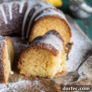 A slice of lemon bundt cake with glaze