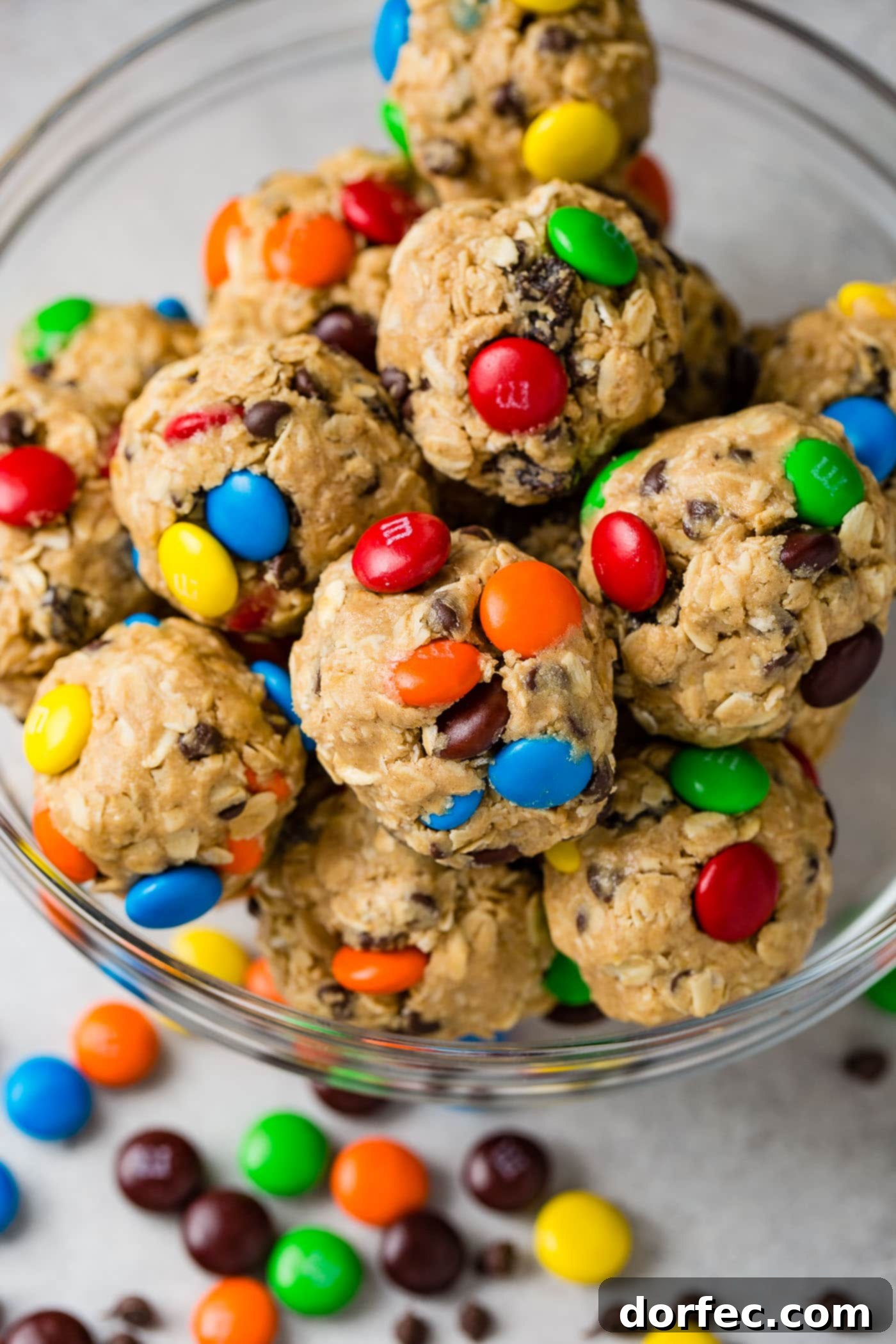 Protein-Packed Peanut Butter Monster Cookie Energy Bites 2 A bowl heaped full of delicious, round peanut butter protein energy balls, ready to be enjoyed as a perfect snack.