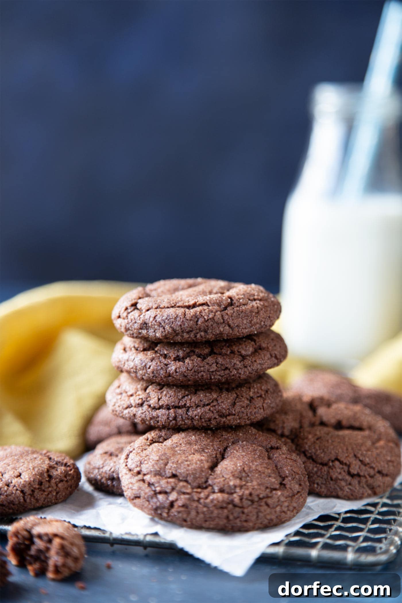A beautifully stacked pile of freshly baked chocolate snickerdoodle cookies, garnished with cinnamon sugar