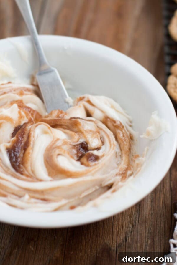 The ultimate cinnamon roll frosting recipe. Rich, creamy cinnamon roll frosting, the perfect complement to homemade cinnamon roll cookies, adding authentic flavor.