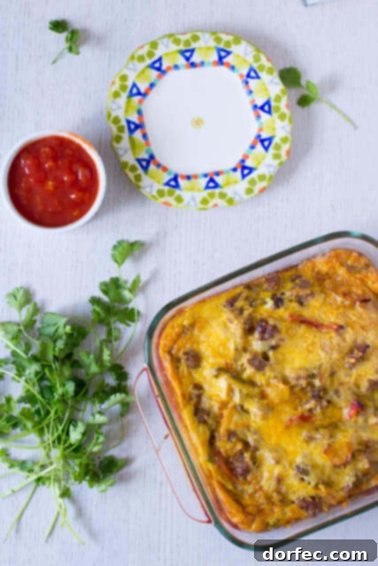 Delicious Mexican Breakfast Enchiladas with sausage, eggs, and peppers Savory Mexican Breakfast Enchiladas made with whole wheat tortillas, colorful bell peppers, breakfast sausage, onions, and eggs. A perfect hearty start to your day.