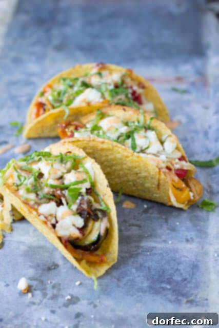 Vegetarian Tacos with Spicy Crema: A Zesty Meatless Delight Flavorful vegetarian tacos with spicy crema, fresh sautéed vegetables, and creamy queso fresco