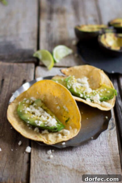Vibrant Veggie Tacos with Spicy Crema 3 Grilled Avocado tacos, an absolute must this summer! They may not look like much, but trust me before you know it you'll be shoveling your 5th taco in your mouth