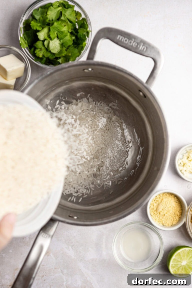 Step-by-step image of adding rice to the saucepan with water.