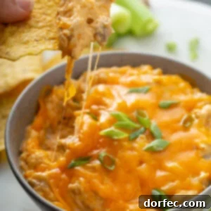 Ultimate Slow Cooker Buffalo Chicken Dip 2 A bowl of buffalo chicken dip, perfect for sharing at any party.
