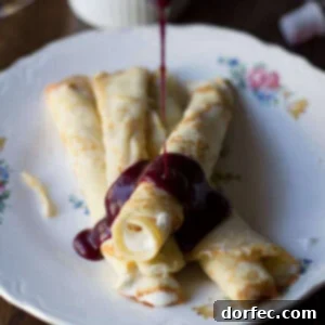 Marionberry Strawberry Syrup served over the most delicious cream filled crepes. #Breakfast at our house is amazing. ohsweetbasil.com_-3