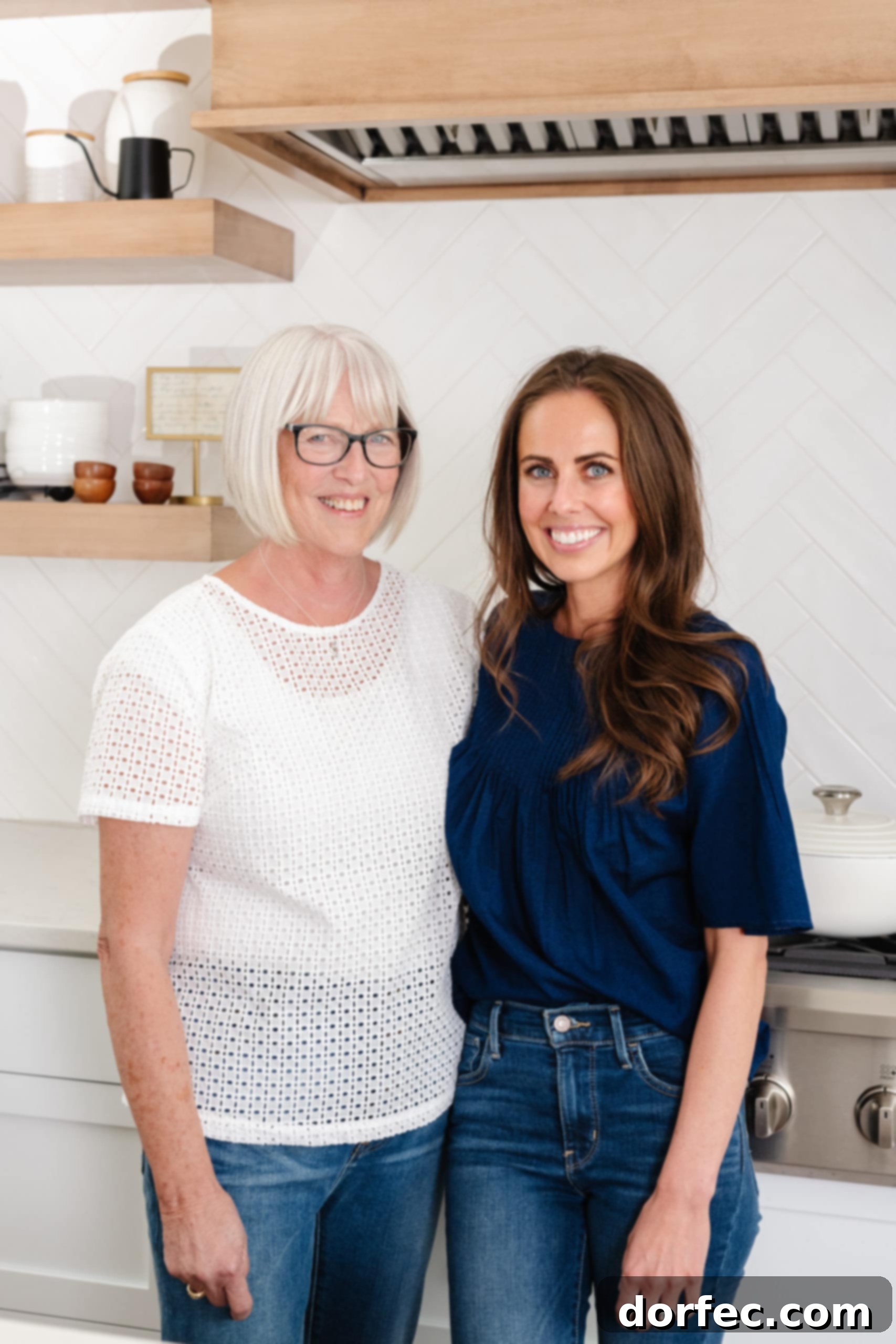 A heartwarming candid shot of a mom with a bright, infectious smile, standing in a kitchen filled with natural light, holding a plate of freshly baked goods. The scene evokes warmth and home baking.