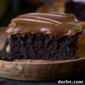 A beautifully decorated chocolate zucchini cake, with smooth, rich frosting.