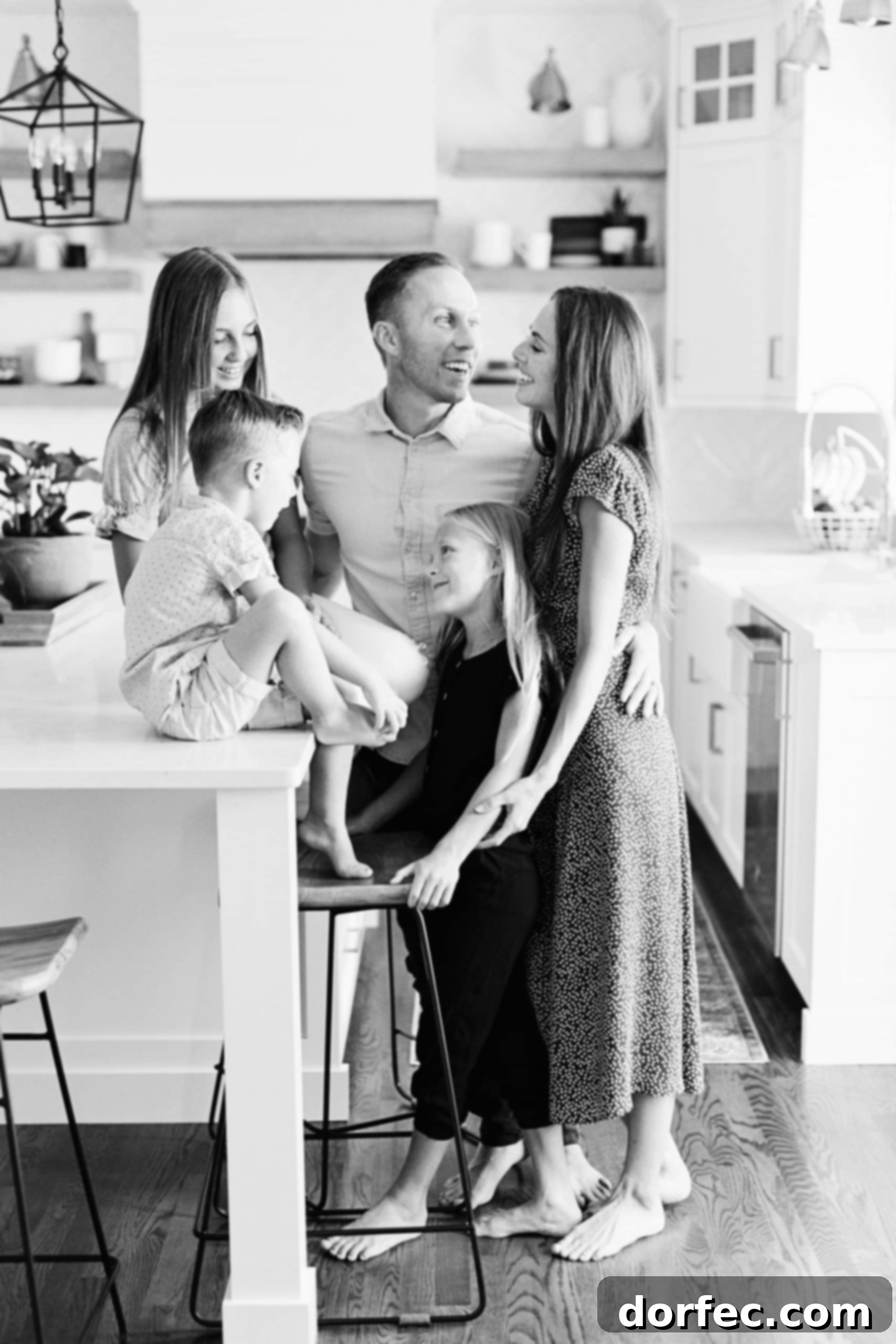 This Family is Going to Fight A photo of a happy family gathered in the kitchen.