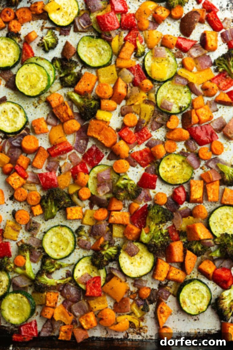 Golden Roasted Vegetable Medley 5 A sheet pan with roasted zuchinni, carrots, sweet potato, bell pepper, onion, and broccoli