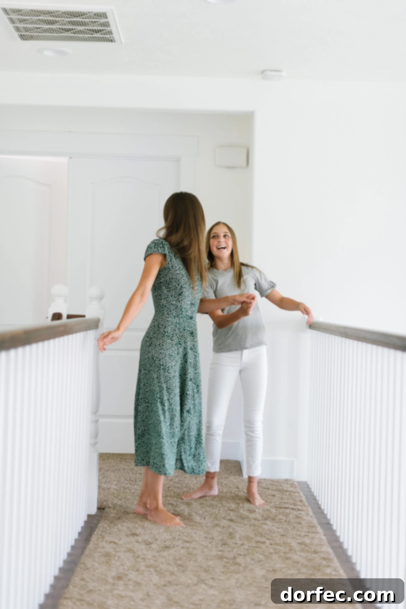 a photo of a mother and teenage daughter laughing together, symbolizing connection and shared moments during parenting
