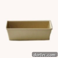 A shimmering gold loaf baking pan, perfect for baking beautiful and evenly cooked bread.