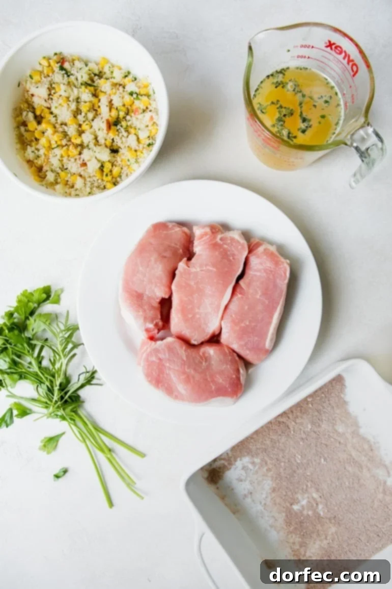 A vibrant flat lay photo showcasing all the fresh ingredients for stuffed pork chops, neatly arranged on individual plates.