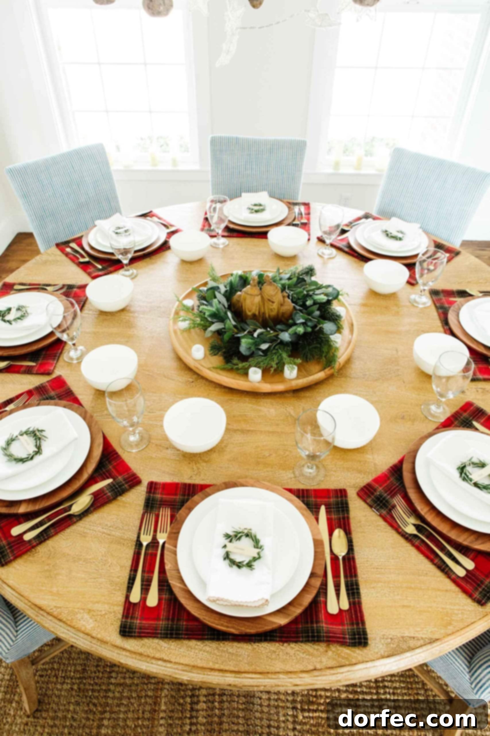 nativity dinner christmas place setting with plaid and rosemary wreaths