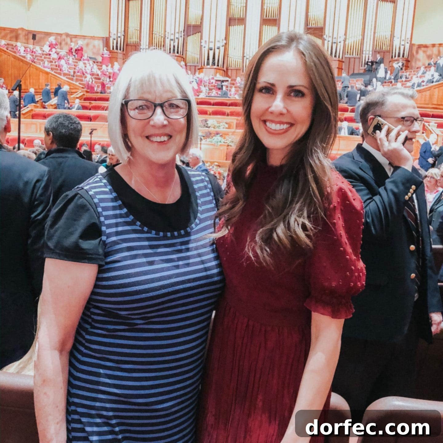 A candid photo of a mother and daughter smiling and embracing, symbolizing familial love and shared wisdom.