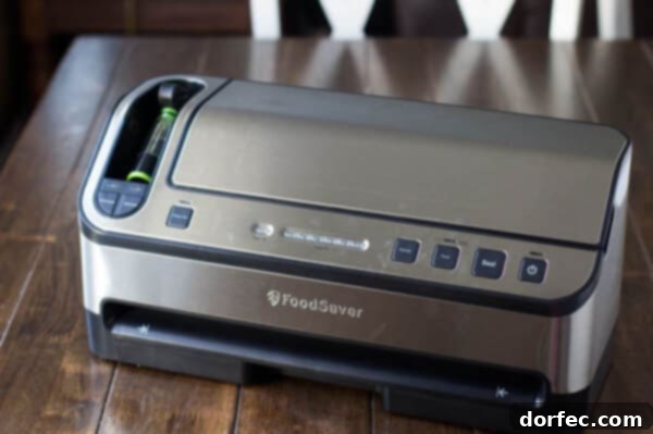 A FoodSaver vacuum sealer machine preparing to seal a bag of food.