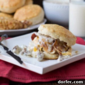 The ultimate Heart Attack sandwich, piled high with sausage gravy, fried chicken, bacon, and cheese.