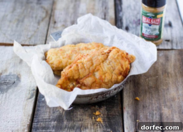 A plate of perfectly golden, crunchy Southern Fried Chicken, irresistible and juicy.