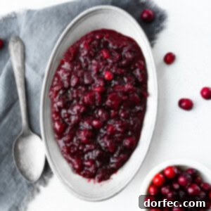 A vibrant close-up of quick and easy cranberry sauce with orange zest, ready to be served.
