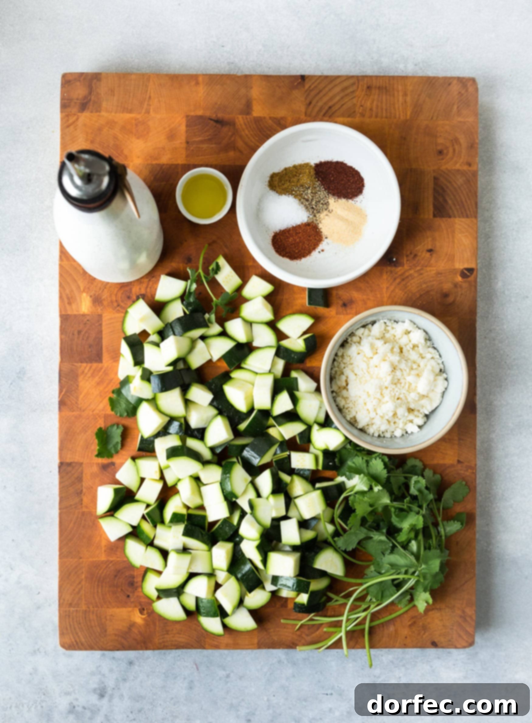 A vibrant platter of Mexican roasted zucchini, garnished with fresh cilantro and crumbled queso fresco, ready to be served as a delightful side dish for a Mexican feast.