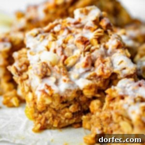 A freshly baked dish of Healthy Apple Fritter Baked Oatmeal, generously topped with a sweet glaze and ready to be served.