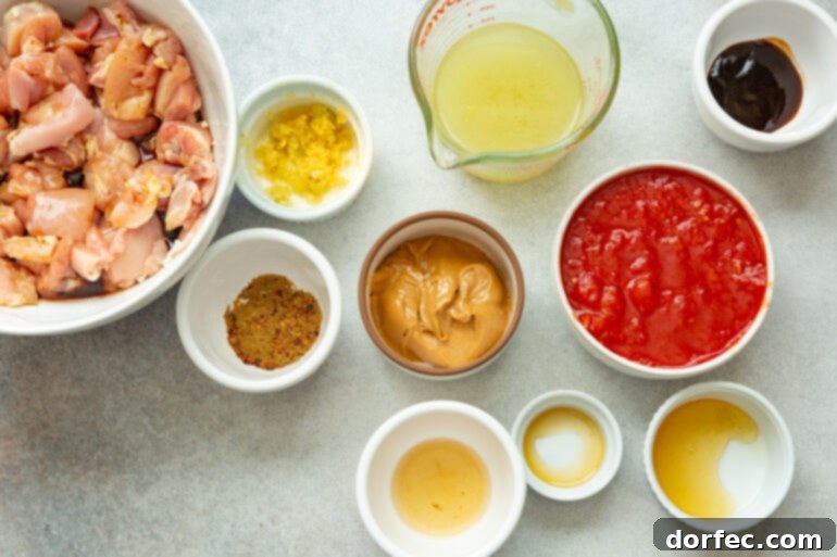 A photo of several small containers, each holding a different ingredient destined for the peanut sauce, showcasing the variety of flavors.