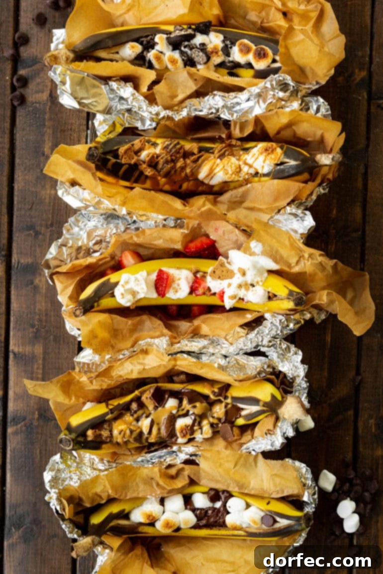 Our Favorite Campfire Banana Boats 2 A vibrant collection of fire-roasted banana boats, each creatively topped with diverse sweets and treats, showcasing a range of delicious dessert possibilities.