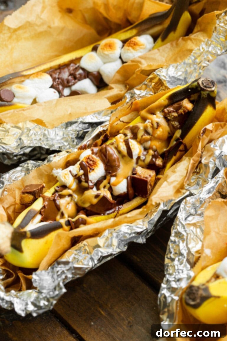 Our Favorite Campfire Banana Boats 4 A decadent campfire banana boat overflowing with chopped Reese's Peanut Butter Cups, gooey marshmallows, and drizzled with rich peanut butter and hot fudge sauces.