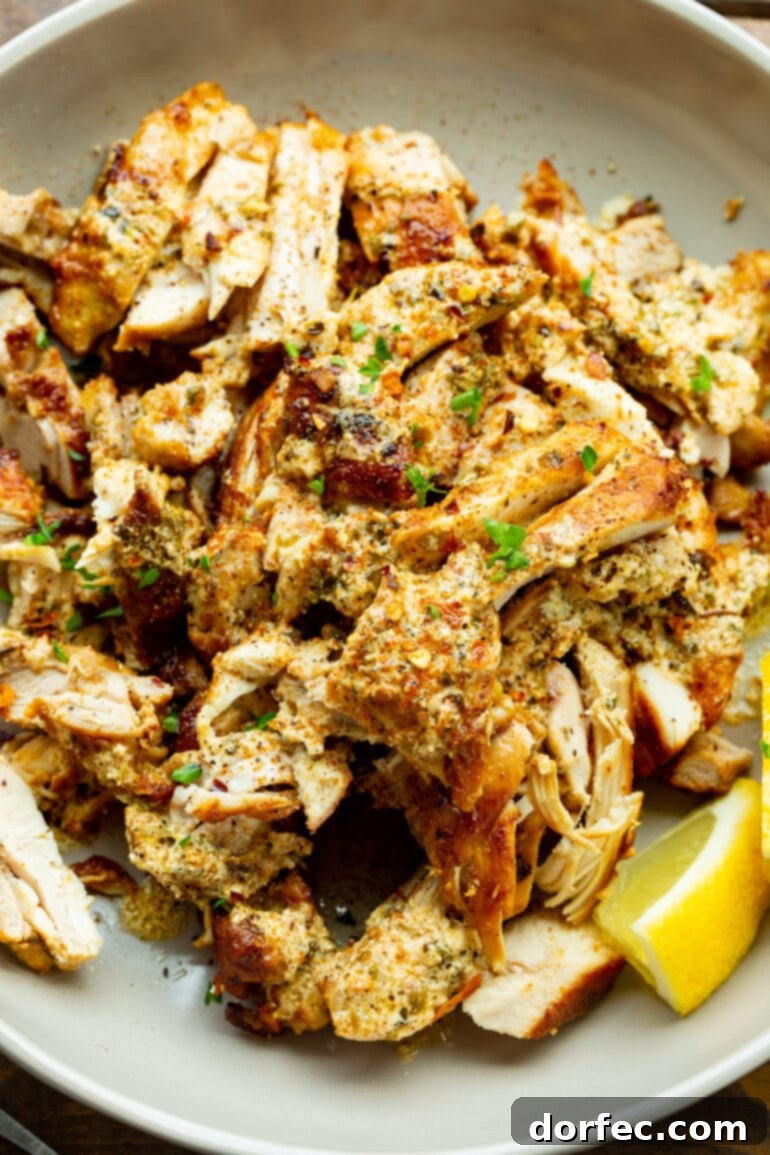 Cade's Signature Chicken Gyros 5 A photo of baked, sliced chicken thighs seasoned with fresh parsley.