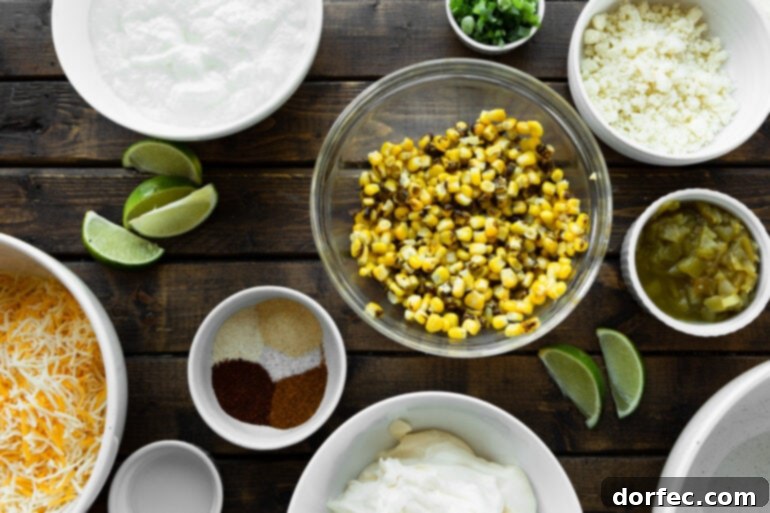 All the vibrant, fresh ingredients for Mexican street corn dip meticulously arranged in separate small bowls, showcasing their diverse colors and textures before mixing.