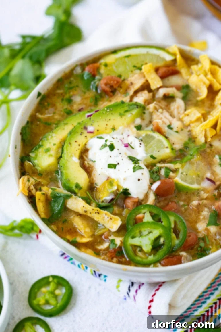 Weekly Meal Plan: September 25 - October 1 7 A hearty and creamy bowl of White Chicken Chili, elegantly garnished with fresh cilantro leaves and a dollop of sour cream, ready to be enjoyed. ohsweetbasil.com