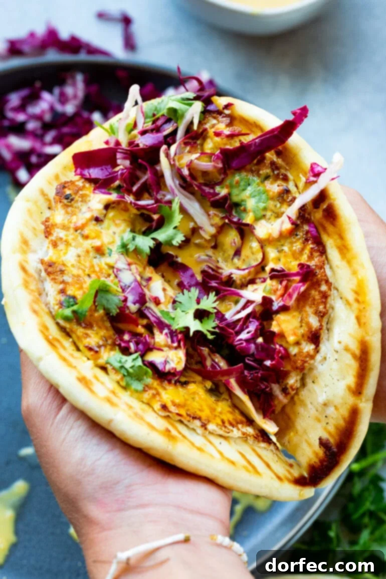 Weekly Meal Plan: September 25 - October 1 9 A delicious and beautifully presented Coconut Curry Chicken Burger, served on golden pita bread, generously topped with fresh radicchio and cilantro, showcasing its vibrant Indian-inspired flavors. ohsweetbasil.com