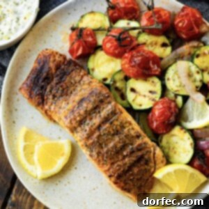 A beautifully grilled salmon fillet, moist and flaky, ready to be served