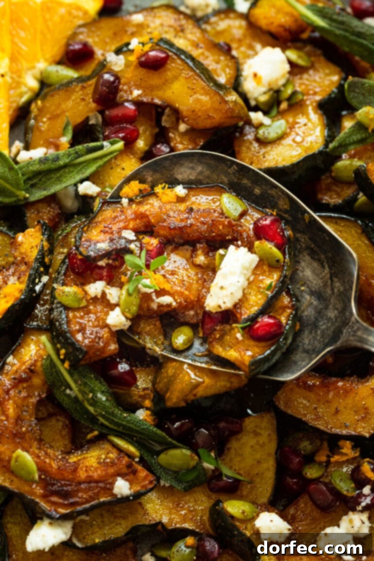 Heartwarming Holiday Acorn Squash 7 A close-up photo of a large serving spoon dishing up a portion of the roasted holiday acorn squash, highlighting its beautiful caramelized edges and festive toppings.