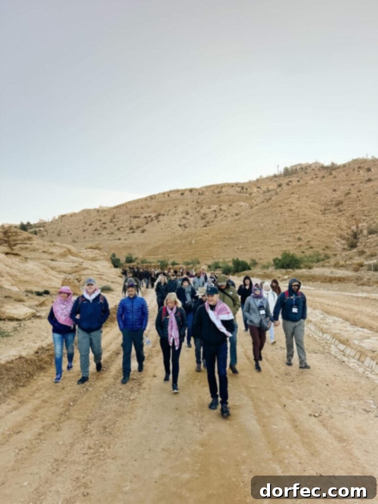 A road with armored vehicles, suggesting a conflict zone or military presence.