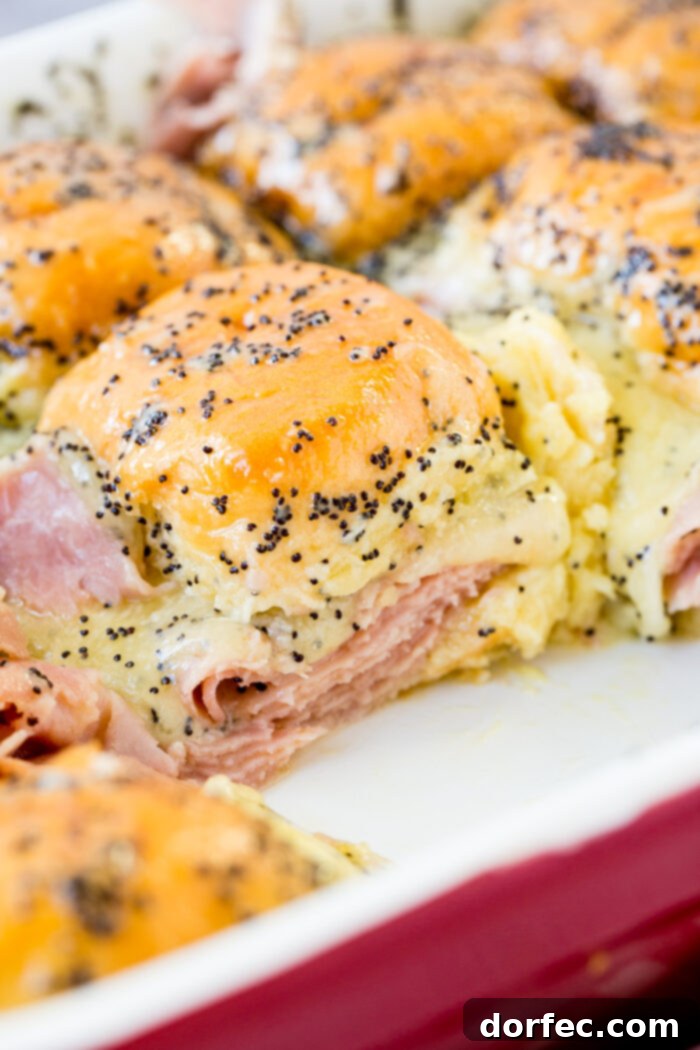 Irresistible ham and cheese sliders with a poppy seed dressing, perfect for New Year's Eve or using leftover ham.
