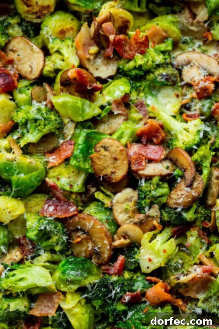a photo of sauteed mushrooms, brussel sprouts and broccoli mixed in a creamy sauce with crispy bacon bits.
