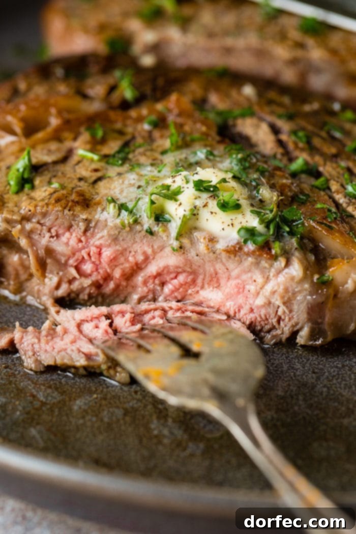 Weekly Menu Plan - Feb. 12-18 5 A perfectly seared garlic butter steak, glistening with melted butter and herbs, resting on a cutting board, ready to be sliced and served.